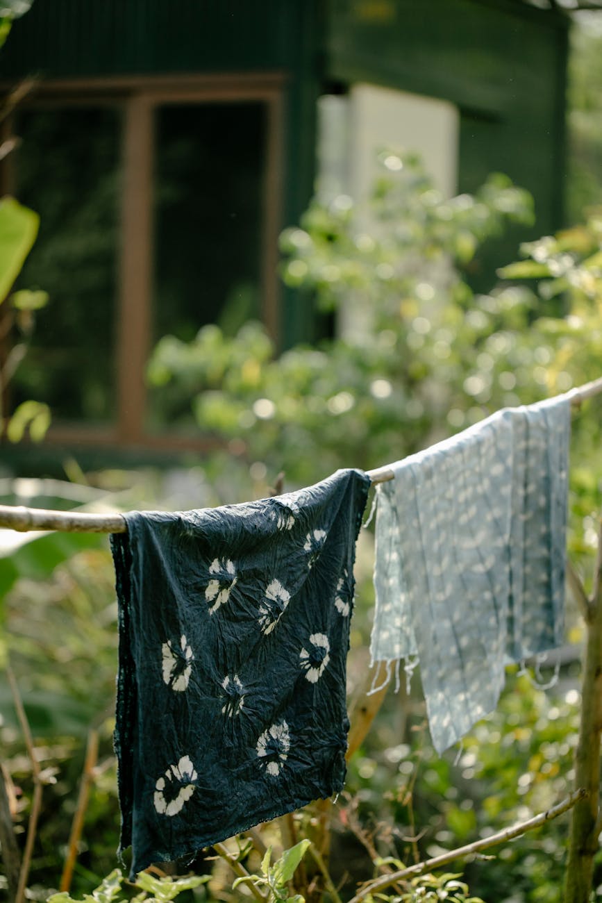 dyed fabric hanging on rope